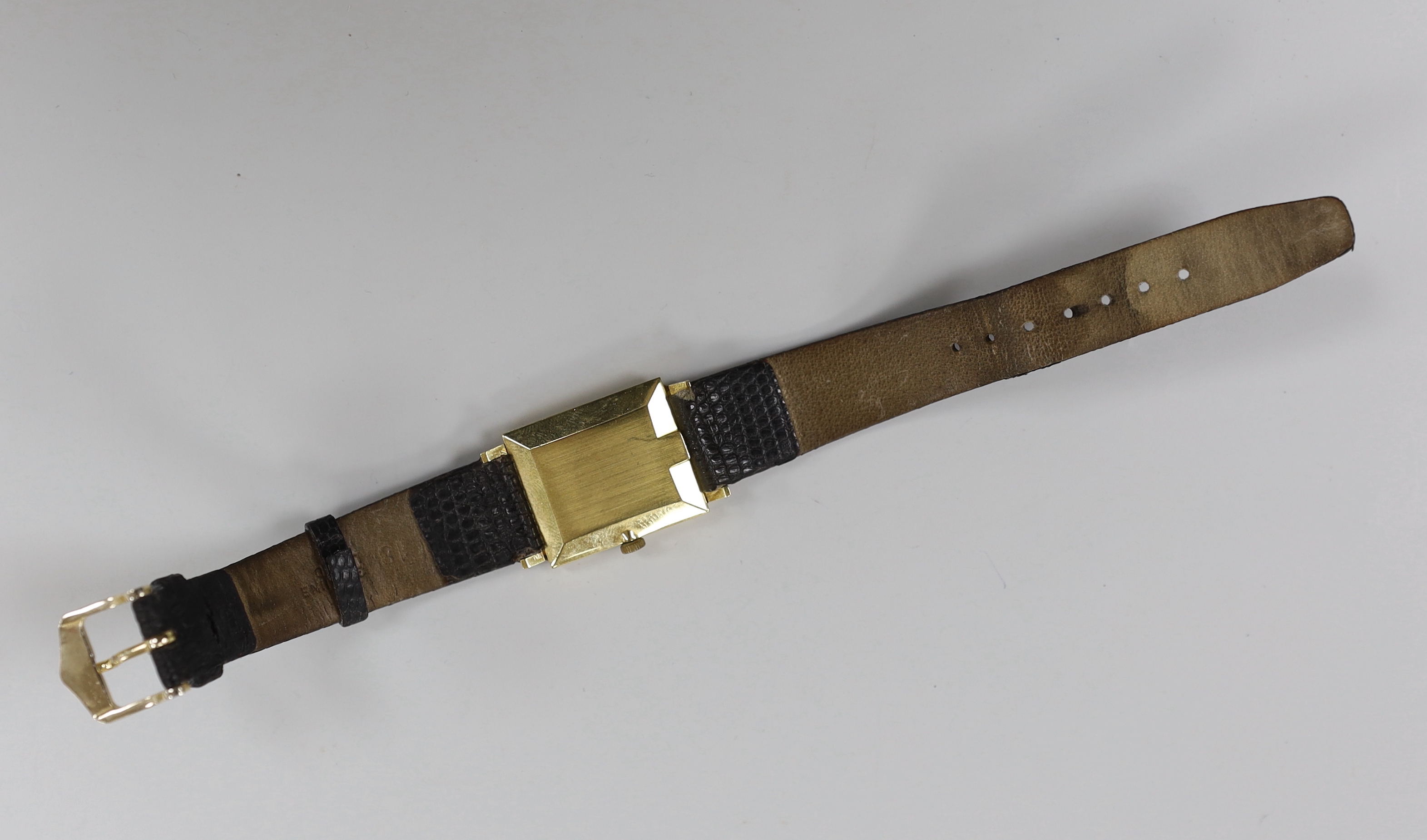 A gentleman's 18k Omega manual wind rectangular dress wrist watch, on associated leather strap, case diameter 24mm, no box or papers.